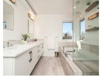 Gary King Plumbing & Electrical logo, bathroom fitter in Walton-on-Thames