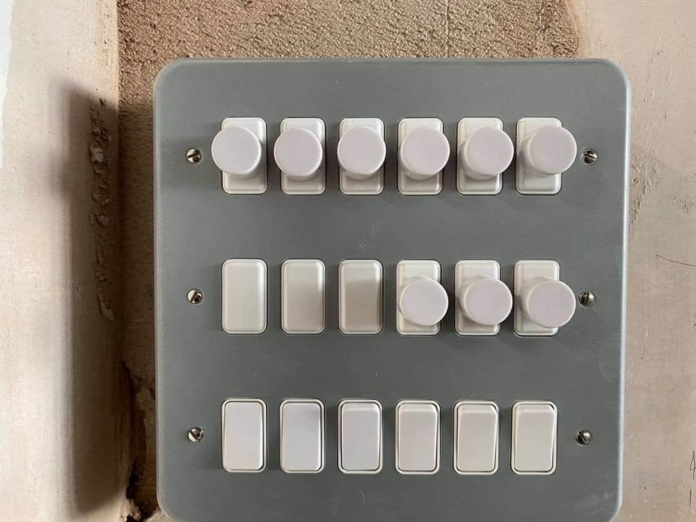 Metal-clad dimmer and switch plate with three rows of six controls