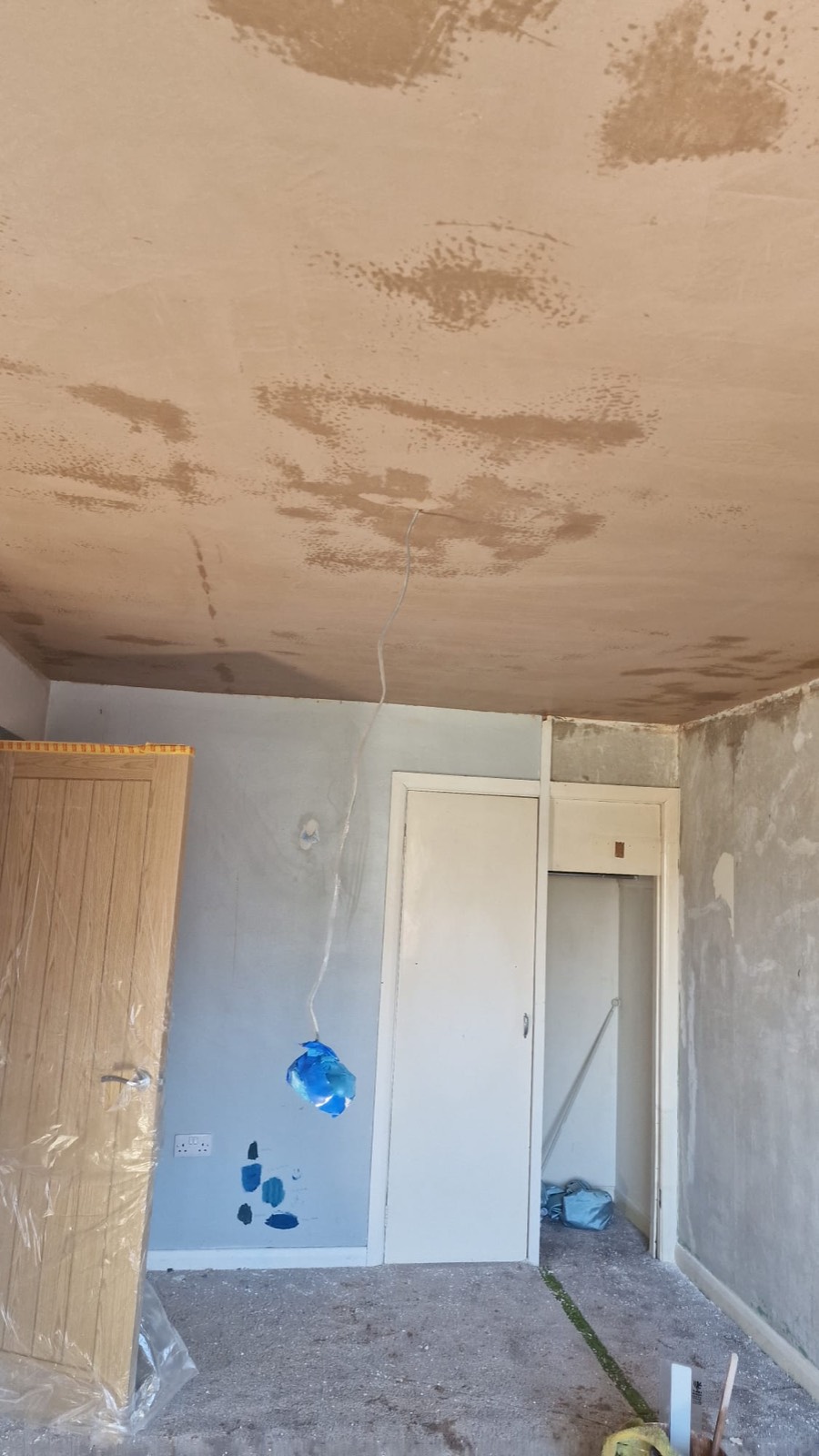 Patched and skimmed ceiling beside a doorway