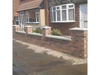 A.J Briffa logo, bricklayer in Swinton