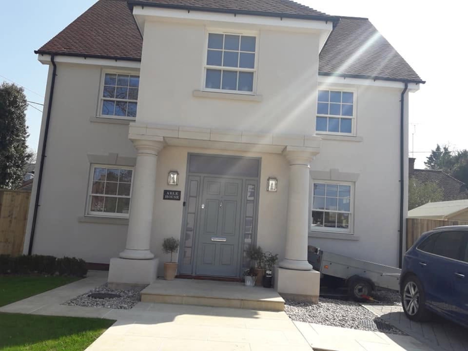 Heath plastering and rendering, Rendered house with French doors opening onto a paved patio